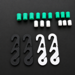 Close-up of white adjustable mask strap extender hook showing smooth adjustment notches