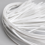 Loose strips of white PE built-in all plastic nose wire showing flexible shape effect