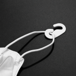 Assorted mask adjusters including colorful silicone toggles and black/white plastic hooks