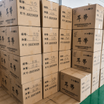 Stacked cartons of mask earloops in Zhaowen warehouse ready for global shipment