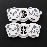 Close-up of cute panda and tiger character exhalation valves for children protective masks