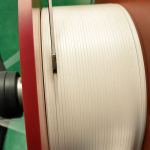White all plastic nose wire on a production spool ready for mask assembly lines