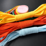 Assorted custom color mask earloops including yellow, orange, and blue - Zhaowen Supply